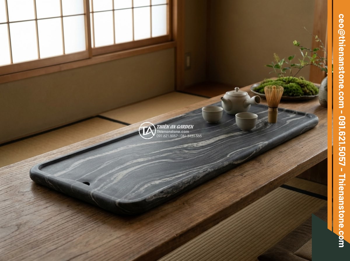 Bàn trà đá cuội - Hình 11 Bàn trà đá cuội - Long-term beauty shot of a well-aged pebble stone tea table in a mature garden,
