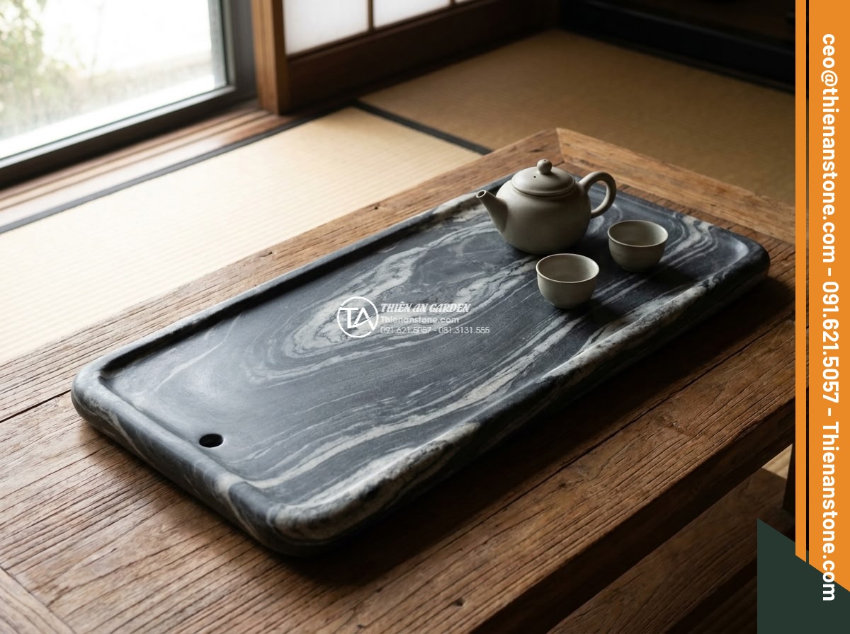 Bàn trà đá cuội - Hình 13 Bàn trà đá cuội - Beautiful integration shot of a pebble stone tea table positioned elegantly besi