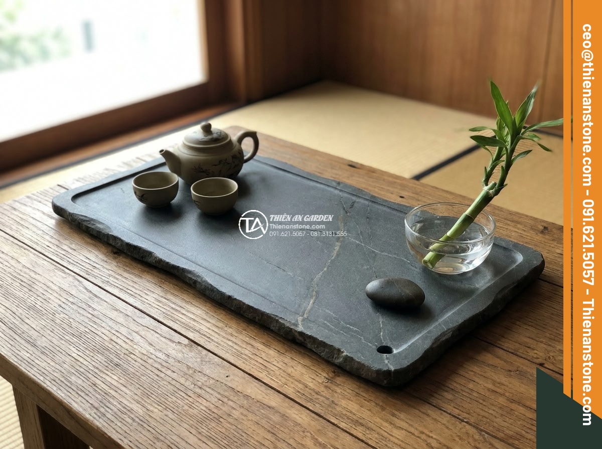 Bàn trà đá cuội - Hình 18 Bàn trà đá cuội - Symbolic close-up of a pebble stone tea table with traditional Vietnamese tea se