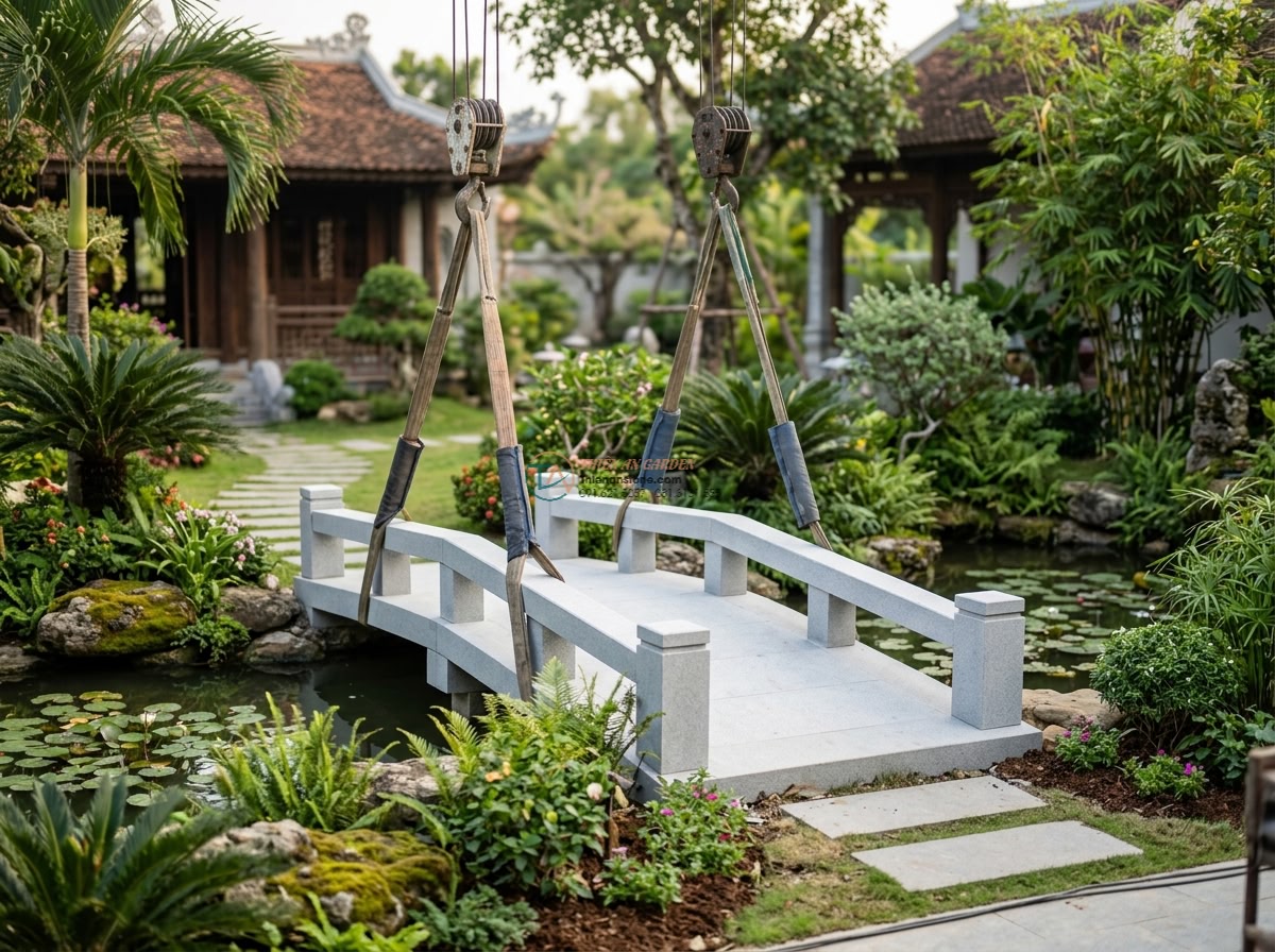 Cầu cổ đá sa thạch vàng chạm khắc hoa văn Zen: 170 x 70 x 15 cm. - Hình 9 Cầu cổ đá sa thạch vàng chạm khắc hoa văn Zen: 170 x 70 x 15 cm. - Expert installation team from Da Canh Thien An carefully positioning the finishe