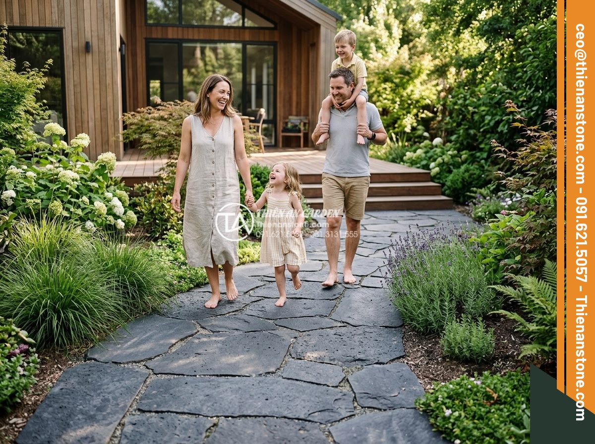 Đá Bazan Quy Cách Bước Dạo - Chất liệu: Đá bazan xám/đen - Kích thước: 30x60cm, dày 2-3cm - Hình 18 Đá Bazan Quy Cách Bước Dạo - Chất liệu: Đá bazan xám/đen - Kích thước: 30x60cm, dày 2-3cm - Happy family walking on newly installed basalt garden path, satisfied customers
