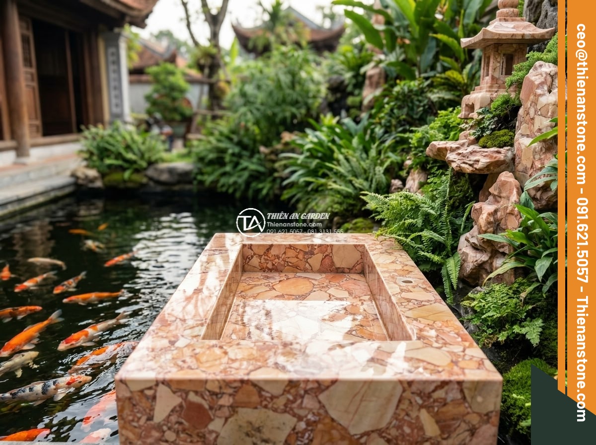 Lavabo đá hồng huyết long chữ nhật 42cm (420x350x140mm) - Hình 7 Lavabo đá hồng huyết long chữ nhật 42cm (420x350x140mm) - Harmonious garden composition showing the pink hong huyet long rectangular lavab