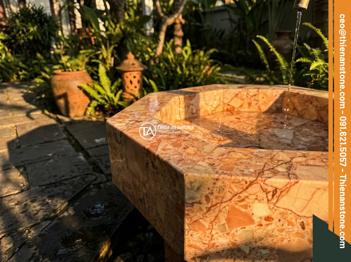 Lavabo đá hồng huyết long đa giác (400x400x150mm) - Hình 8 Lavabo đá hồng huyết long đa giác (400x400x150mm) - Dramatic golden hour lighting on hexagonal pink blood dragon stone lavabo in gar