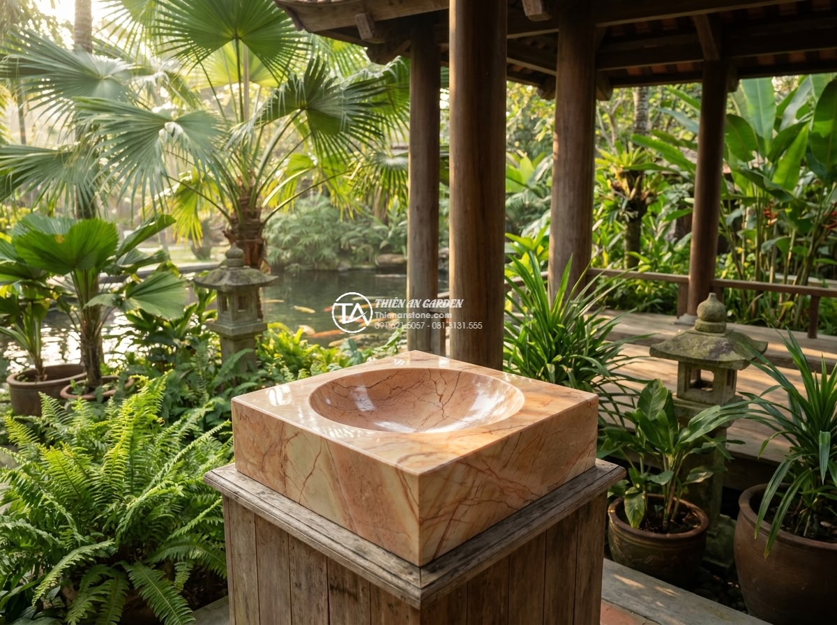 Lavabo đá hồng huyết long góc (400x400x150mm) - Wide angle cinematic shot of a premium corner lavabo made from rare pink dragon
