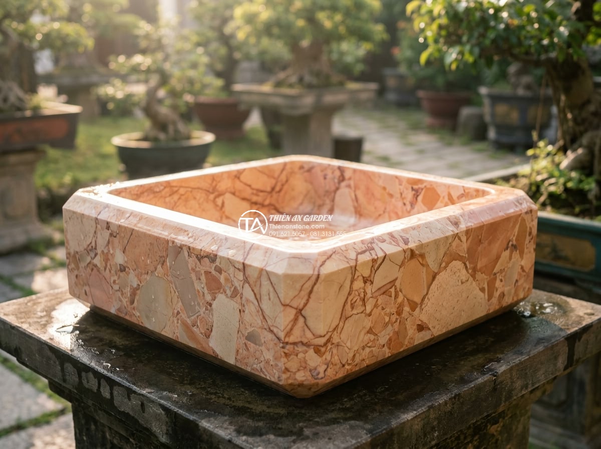 Lavabo đá hồng huyết long hình vuông vát cạnh (400x400x150mm) - Close-up cinematic view of a square pink blood dragon stone lavabo 400x400x150mm