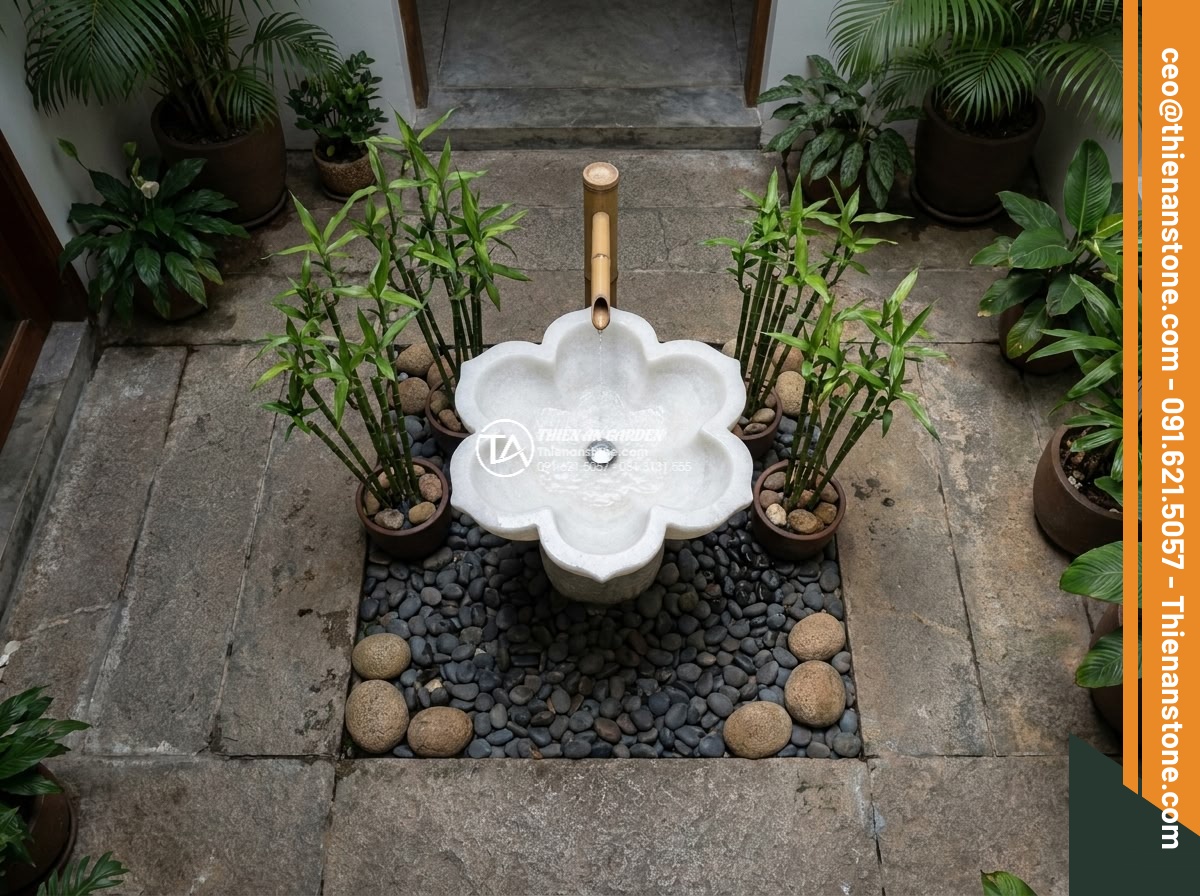 Lavabo đá trắng cẩm thạch hình bông hoa (400x400x150mm) - Hình 5 Lavabo đá trắng cẩm thạch hình bông hoa (400x400x150mm) - Artistic overhead view of white marble flower lavabo surrounded by symbolic feng