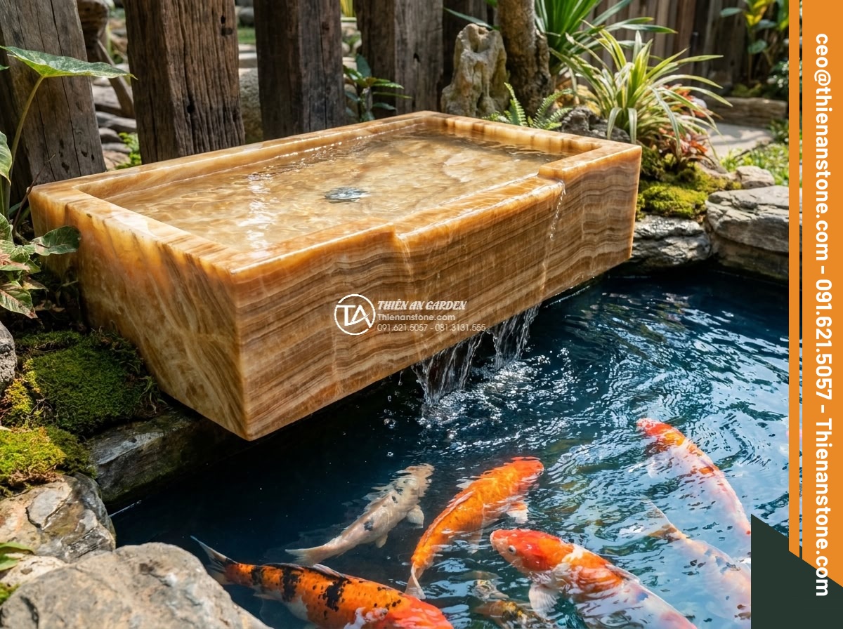 Lavabo đá vân gỗ hình trụ nông cao 15cm (400x400x150mm) - Hình 16 Lavabo đá vân gỗ hình trụ nông cao 15cm (400x400x150mm) - Detailed view of water gently overflowing from the shallow natural stone lavabo