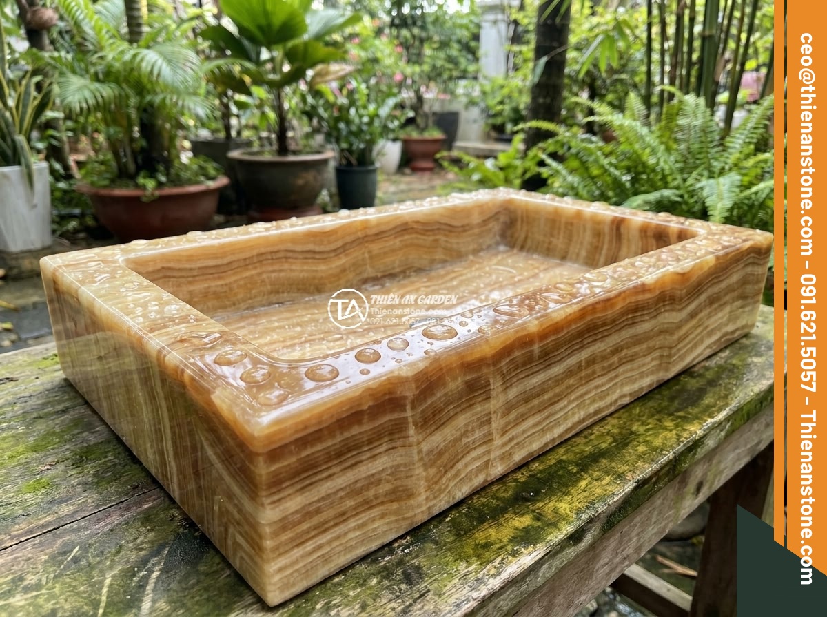 Lavabo đá vân gỗ hình trụ nông cao 15cm (400x400x150mm) - Hình 8 Lavabo đá vân gỗ hình trụ nông cao 15cm (400x400x150mm) - High detail macro photograph of water beading on the treated surface of the natu