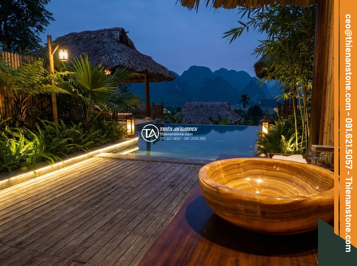 Lavabo đá vân gỗ tròn 42cm (420x420x150mm) - Hình 9 Lavabo đá vân gỗ tròn 42cm (420x420x150mm) - Upscale resort outdoor spa area with a 42cm round natural stone sink featuring w