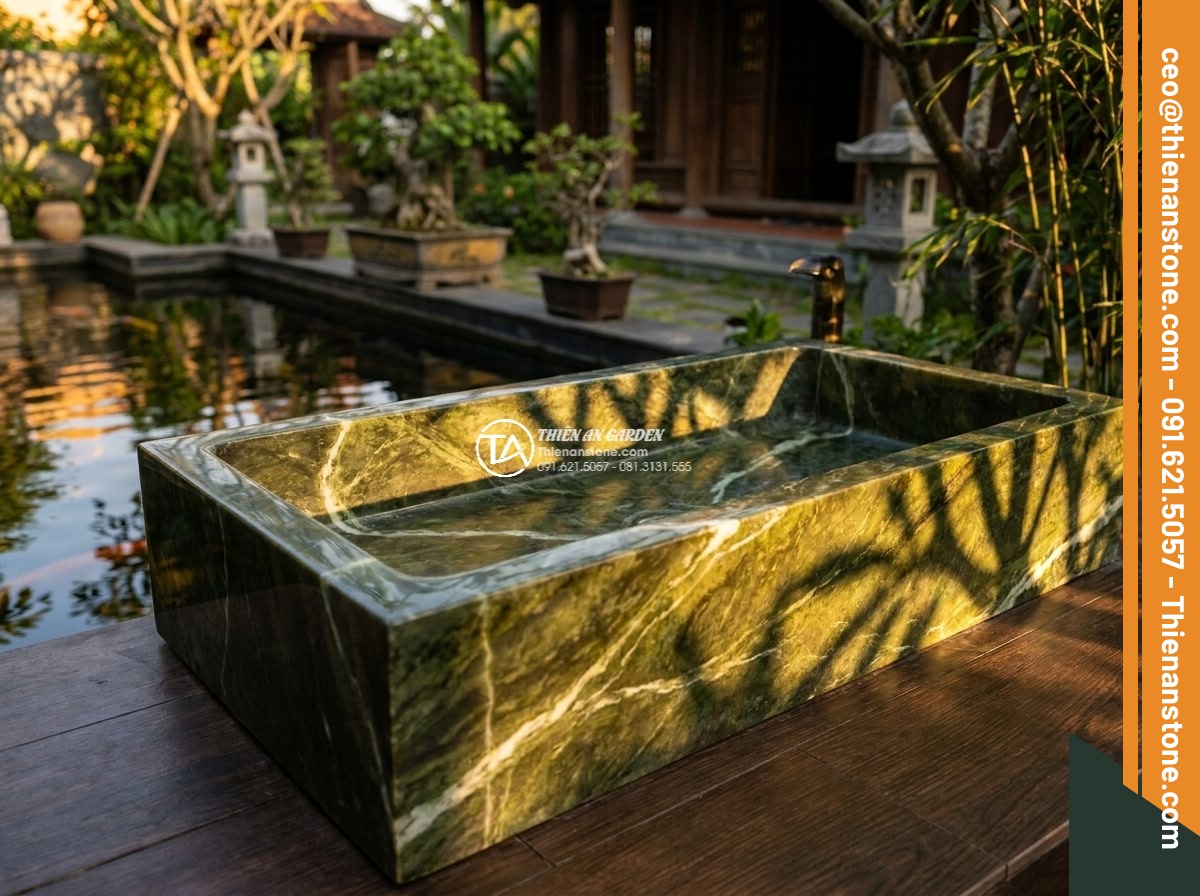 Lavabo đá xanh Ngọc Secpentine chữ nhật 42cm (420x350x140mm) - Hình 5 Lavabo đá xanh Ngọc Secpentine chữ nhật 42cm (420x350x140mm) - Golden hour cinematic shot of the rectangular green serpentine stone sink glowin