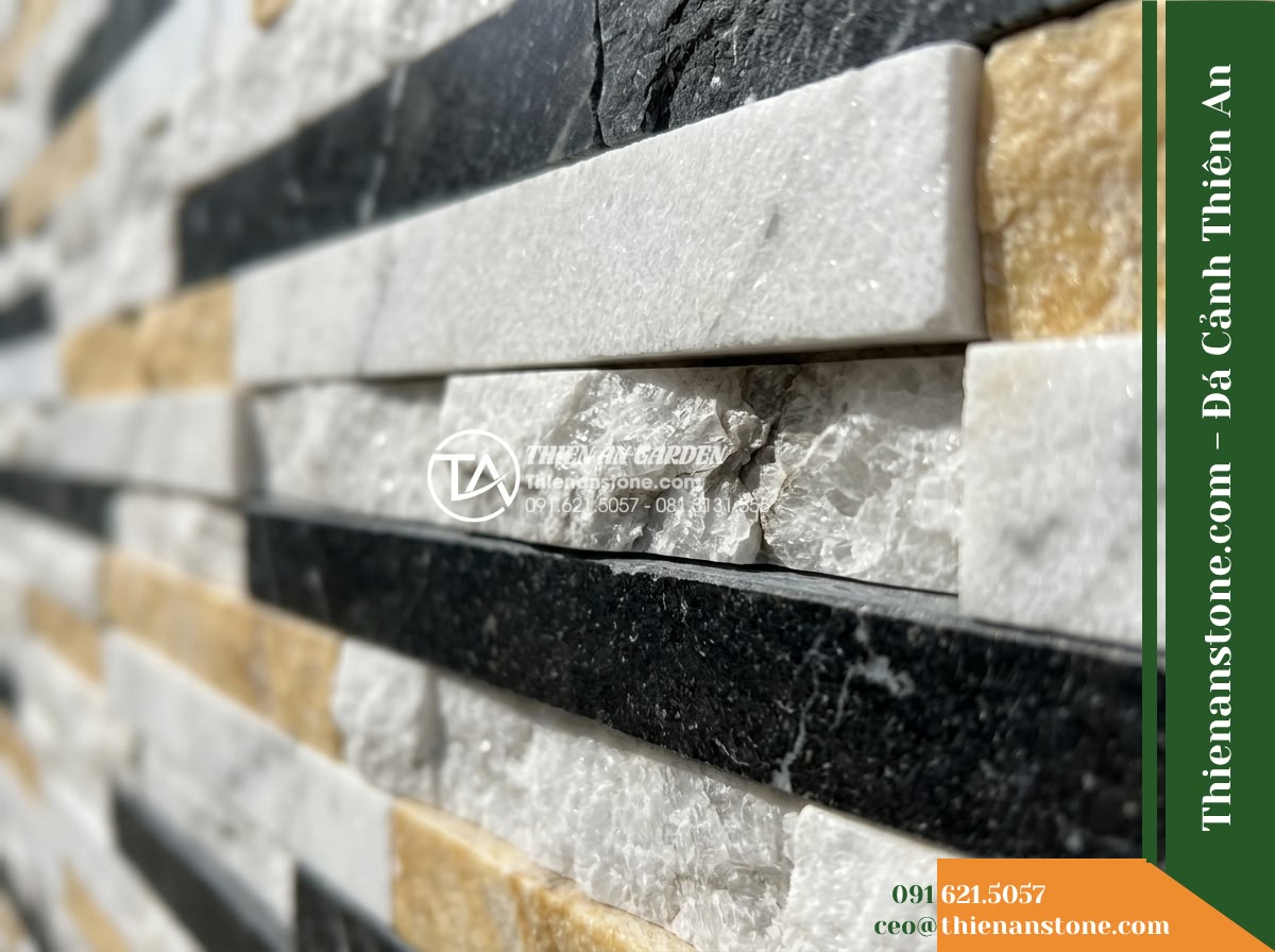 Đá ghép 3 màu Nghệ An | Marble phối 3 màu (Trắng - Vàng - Đen Nghệ An) | 10x50 cm - Hình 15 Đá ghép 3 màu Nghệ An | Marble phối 3 màu (Trắng - Vàng - Đen Nghệ An) | 10x50 cm - A macro shot focusing on the delicate horizontal clefts and recessed crevices be