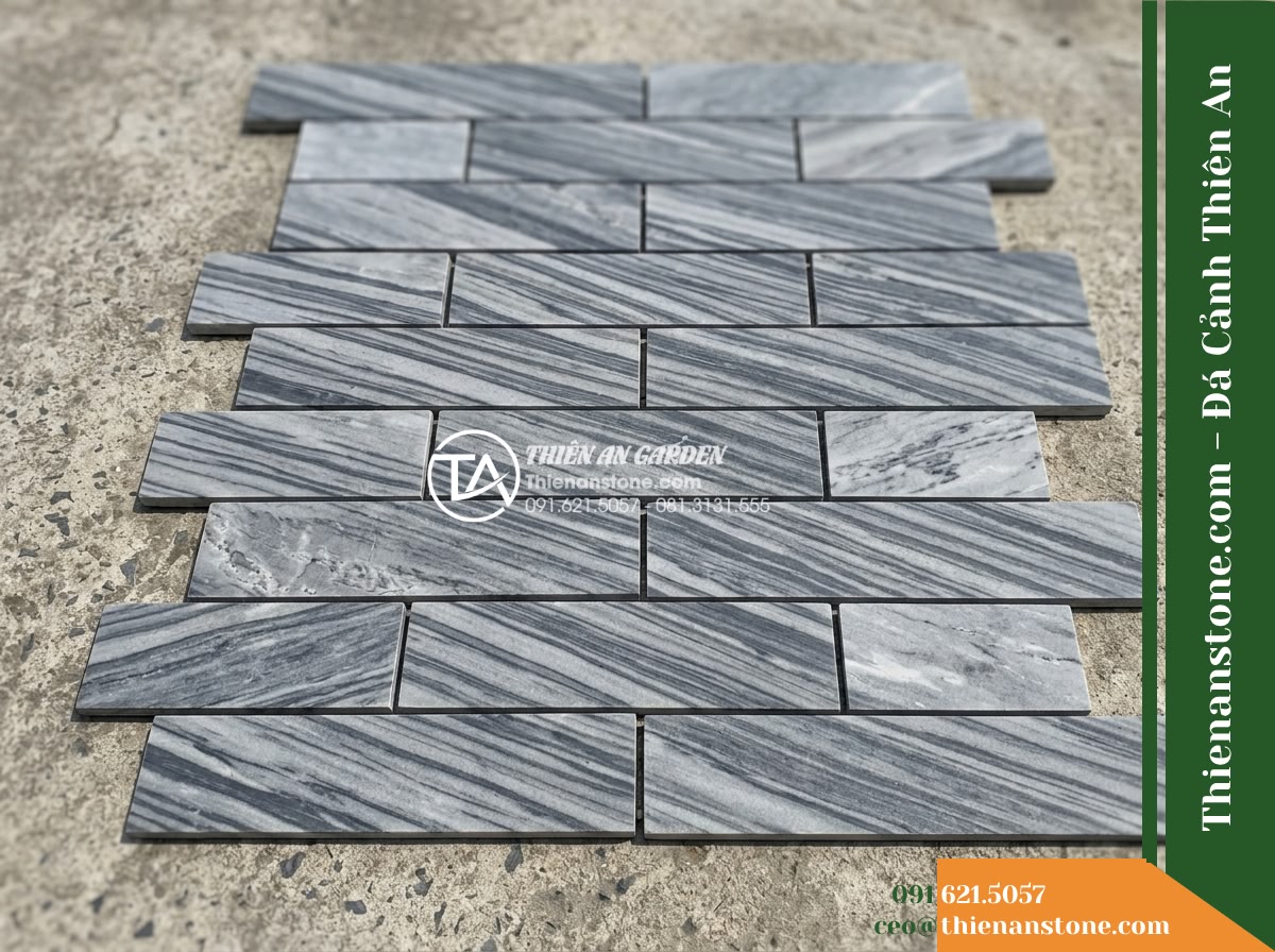 Đá ghép sọc dưa Hà Tĩnh | Marble sọc dưa Hà Tĩnh | 10x50 cm - Hình 7 Đá ghép sọc dưa Hà Tĩnh | Marble sọc dưa Hà Tĩnh | 10x50 cm - Flat-lay dry layout of natural striped marble modular tiles laid on outdoor conc
