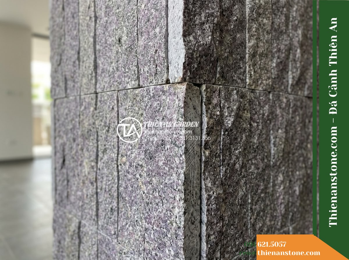 Đá ghép tím Khánh Hòa | Granite tím Khánh Hòa | 10x50 cm - Hình 6 Đá ghép tím Khánh Hòa | Granite tím Khánh Hòa | 10x50 cm - Detail shot of the terminal edge of a 10x50 cm stacked stone panel meeting an op