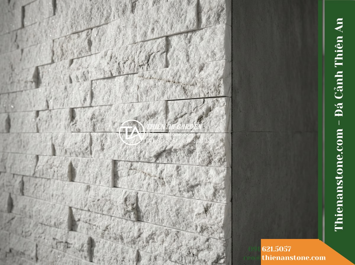 Đá ghép trắng ánh kim Yên Bái | Thạch anh / Marble trắng Yên Bái | 10x50 cm - Hình 9 Đá ghép trắng ánh kim Yên Bái | Thạch anh / Marble trắng Yên Bái | 10x50 cm - Architectural detail showing the junction between a textured white stone feature