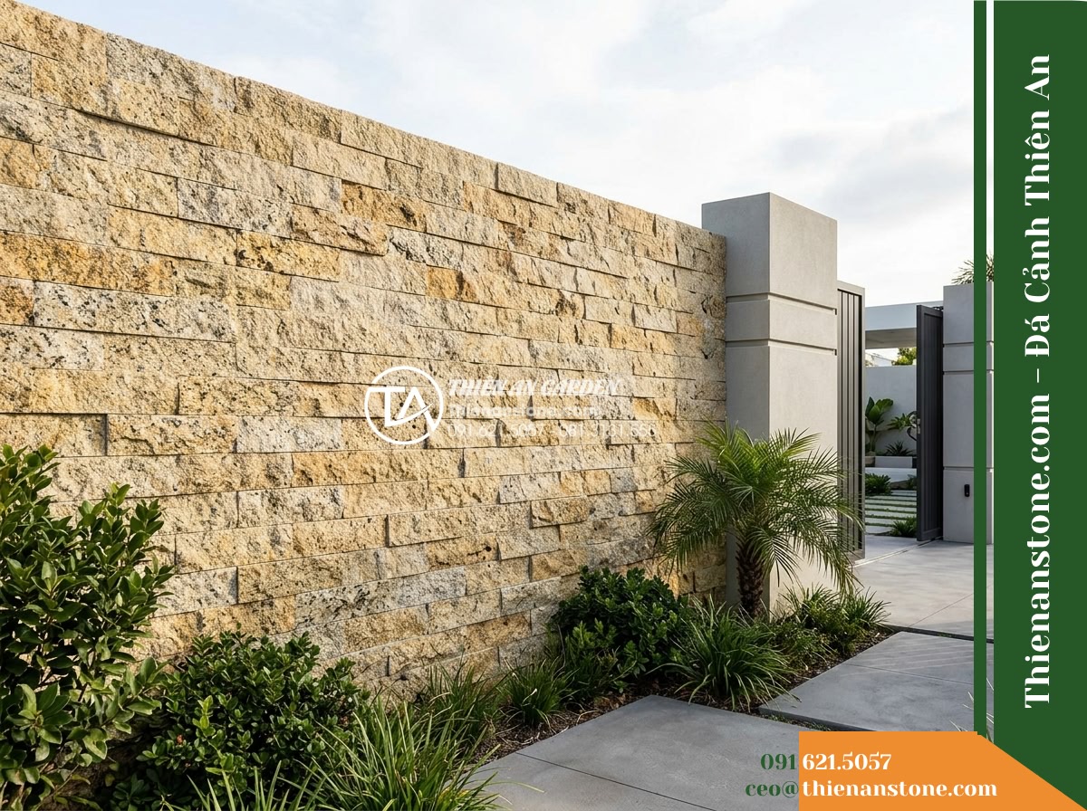 Đá ghép vàng Bình Định | Granite / Marble vàng Bình Định | 10x50 cm - Hình 12 Đá ghép vàng Bình Định | Granite / Marble vàng Bình Định | 10x50 cm - Contextual view of an outdoor entrance wall featuring yellow natural stone cladd