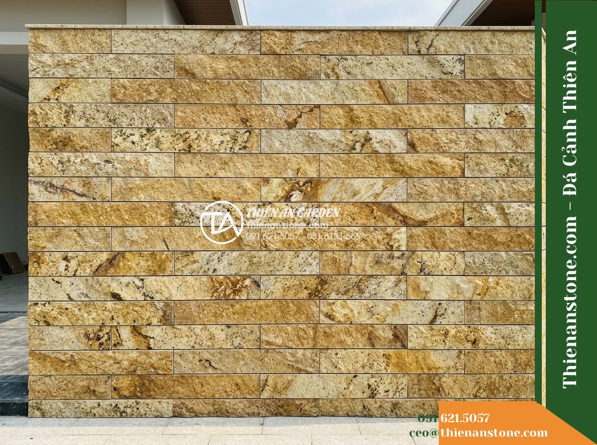 Đá ghép vàng Bình Định | Granite / Marble vàng Bình Định | 10x50 cm - Hình 17 Đá ghép vàng Bình Định | Granite / Marble vàng Bình Định | 10x50 cm - Direct frontal view of an exterior wall segment showing 10x50 cm modular stone s
