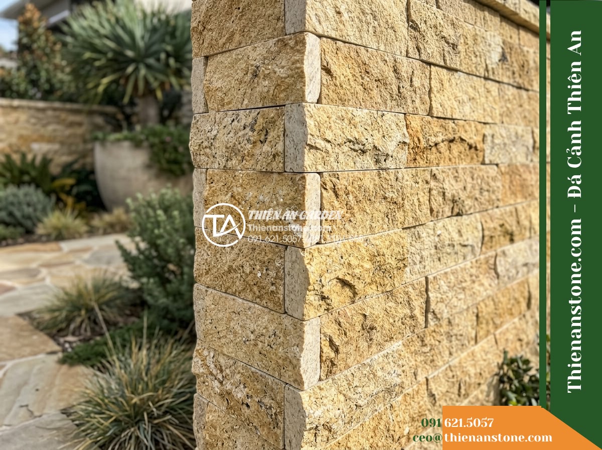Đá ghép vàng Bình Định | Granite / Marble vàng Bình Định | 10x50 cm - Hình 20 Đá ghép vàng Bình Định | Granite / Marble vàng Bình Định | 10x50 cm - Final close atmospheric shot of the completed outdoor stone welcoming wall corne