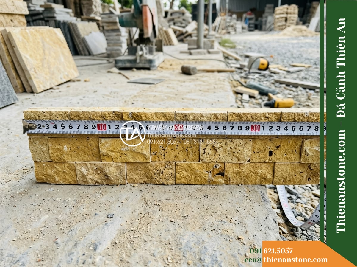 Đá ghép vàng Quỳ Hợp | Đá vôi vàng Quỳ Hợp | 10x40 cm - Hình 17 Đá ghép vàng Quỳ Hợp | Đá vôi vàng Quỳ Hợp | 10x40 cm - Frontal detail view showing measuring tape placed against a 10x40 cm yellow lime