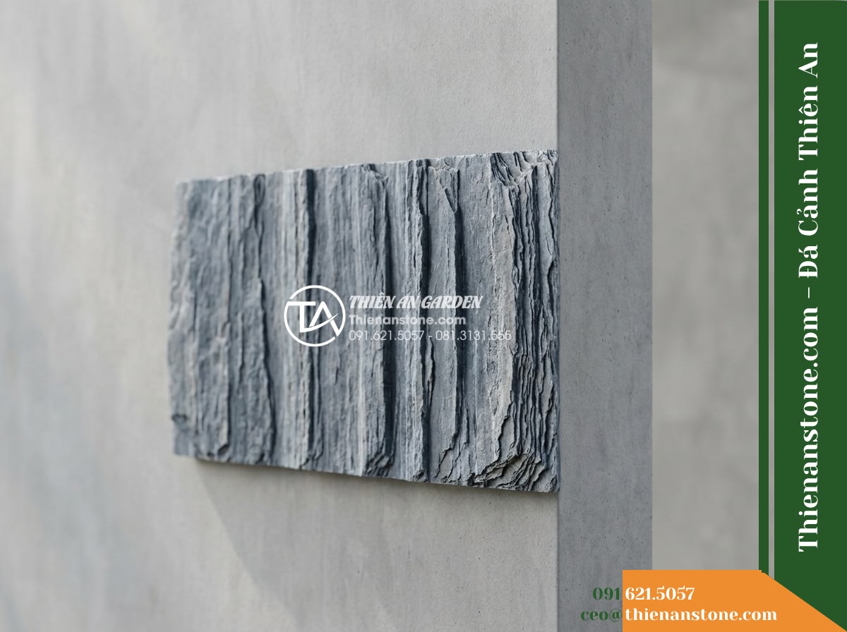 Đá Ông Phú (Tấm 20x40cm) | Chuyên ốp vách tường hồ, làm mảng tường trang trí cảnh quan. - Hình 11 Đá Ông Phú (Tấm 20x40cm) | Chuyên ốp vách tường hồ, làm mảng tường trang trí cảnh quan. - A clean comparative display of a single 20x40cm stone panel installed neatly on