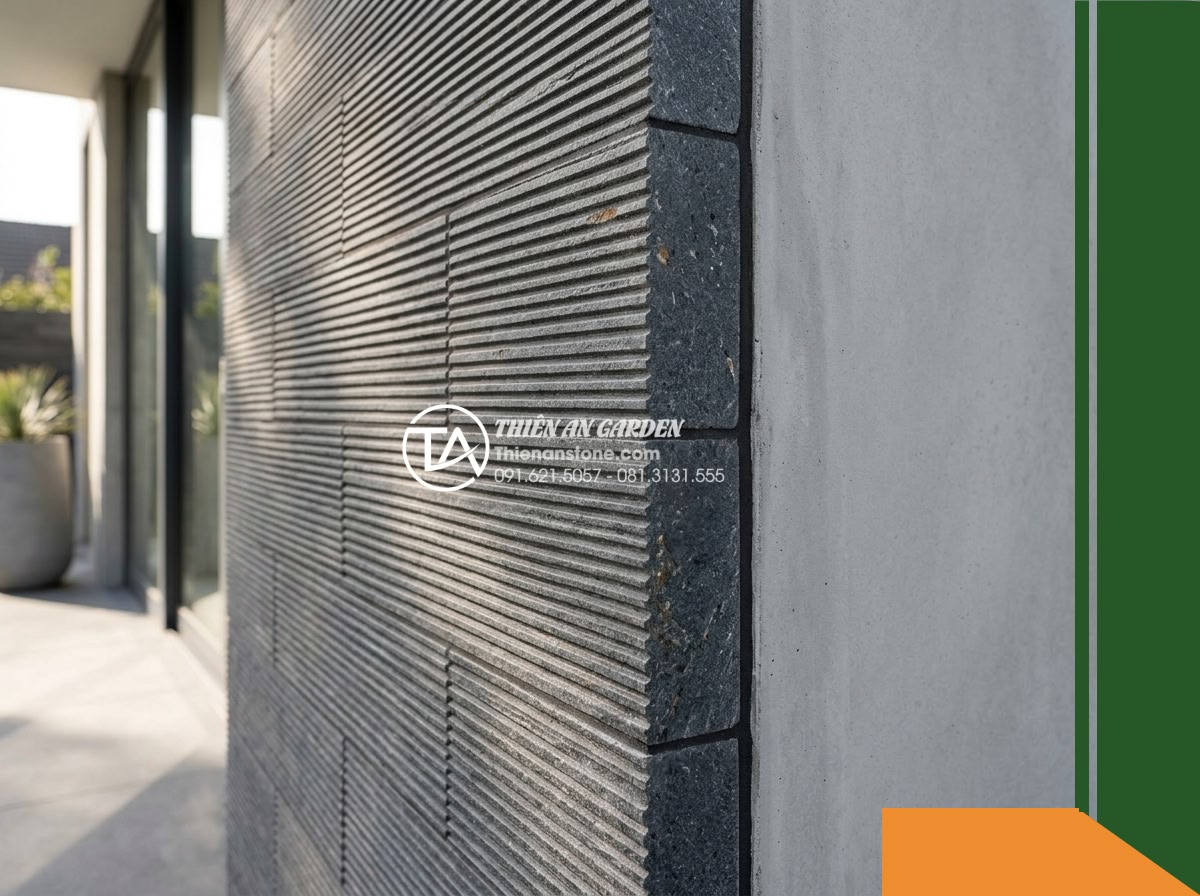 Đá răng lược bazan Gia Lai | Bazan xám đen Gia Lai | 10x50 cm - Hình 2 Đá răng lược bazan Gia Lai | Bazan xám đen Gia Lai | 10x50 cm - A close-angled architectural view showing the perimeter edge of an exterior entr