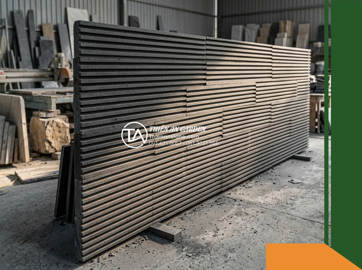 Đá răng lược bazan Gia Lai | Bazan xám đen Gia Lai | 10x50 cm - Hình 8 Đá răng lược bazan Gia Lai | Bazan xám đen Gia Lai | 10x50 cm - A wider workshop perspective of an expansive trial mockup panel of comb-toothed