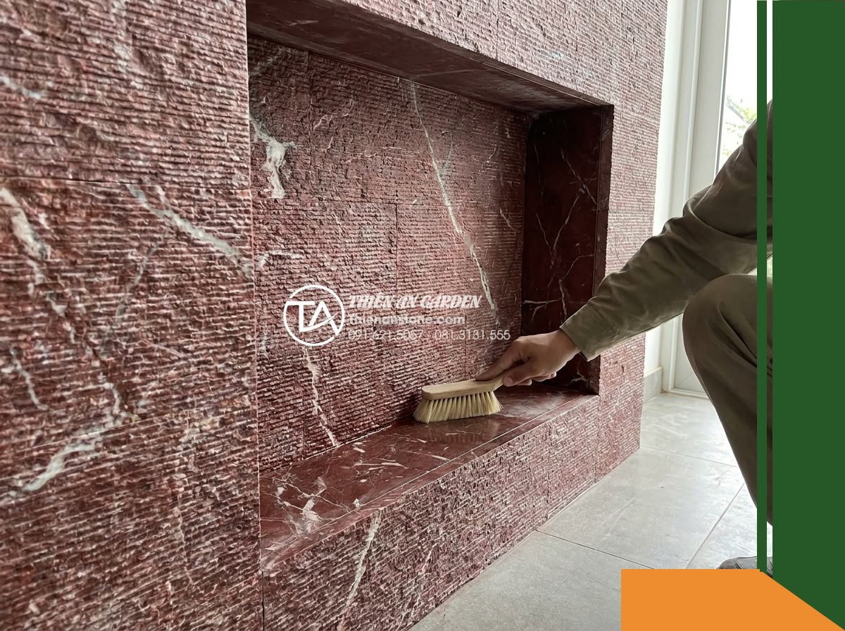 Đá răng lược đỏ mận Nghệ An | Marble đỏ mận Nghệ An | 10x50 cm - Hình 16 Đá răng lược đỏ mận Nghệ An | Marble đỏ mận Nghệ An | 10x50 cm - Wide angle view showing a homeowner or cleaner maintaining the bottom corner and