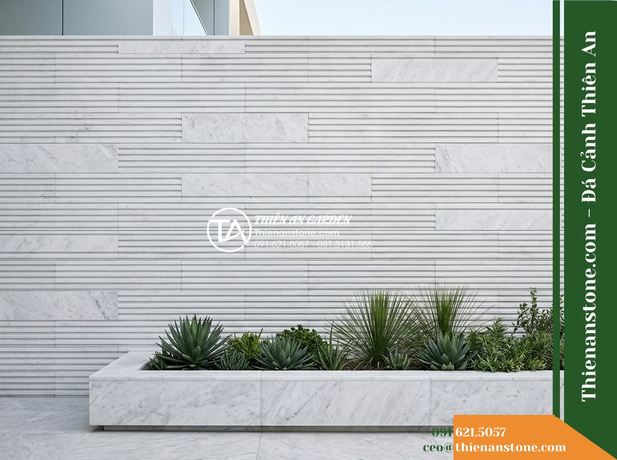 Đá răng lược trắng Nghệ An | Marble trắng Nghệ An | 10x50 cm - Hình 5 Đá răng lược trắng Nghệ An | Marble trắng Nghệ An | 10x50 cm - Straight-on architectural elevation photograph of a textured white marble wall c