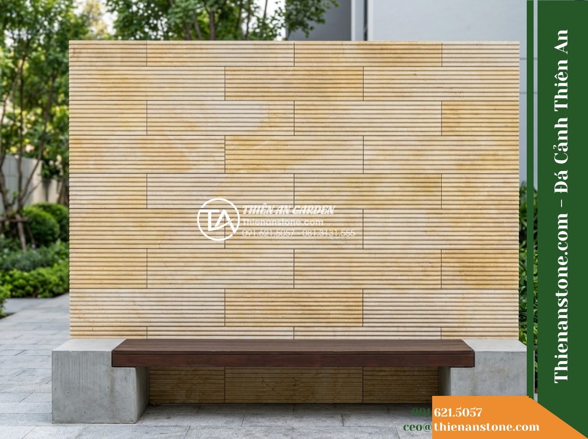 Đá răng lược vàng Nghệ An | Marble vàng Nghệ An | 10x50 cm - Hình 5 Đá răng lược vàng Nghệ An | Marble vàng Nghệ An | 10x50 cm - A straight-on architectural view of an outdoor bench feature wall clad with 10x5