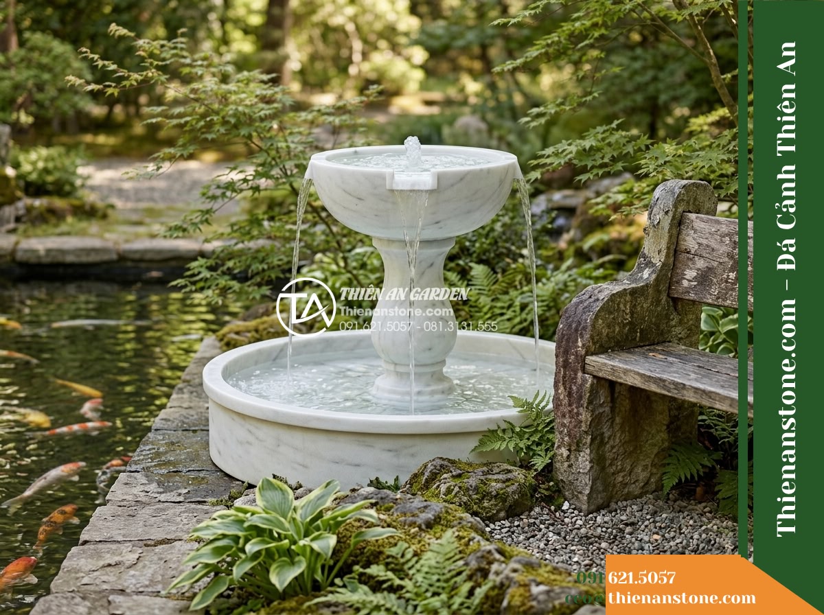 Đài Phun 2 Bát Tròn Chảy Tràn Hồ Koi, Bát D60cm Cao 1m - Hình 18 Đài Phun 2 Bát Tròn Chảy Tràn Hồ Koi, Bát D60cm Cao 1m - Realistic photo of the fully installed two-tier fountain situated cleanly betwee