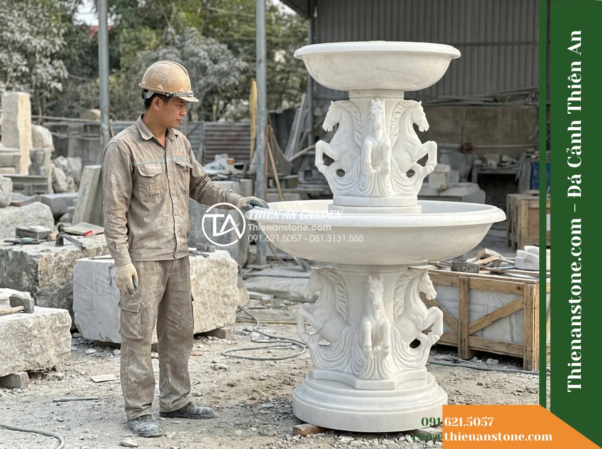 Đài Phun 3 Tầng Chạm Ngựa Apanh Phun, Bát D1.5m Cao 2.2m - Hình 19 Đài Phun 3 Tầng Chạm Ngựa Apanh Phun, Bát D1.5m Cao 2.2m - Master craftsman in work clothes standing beside the completed three-tiered ston