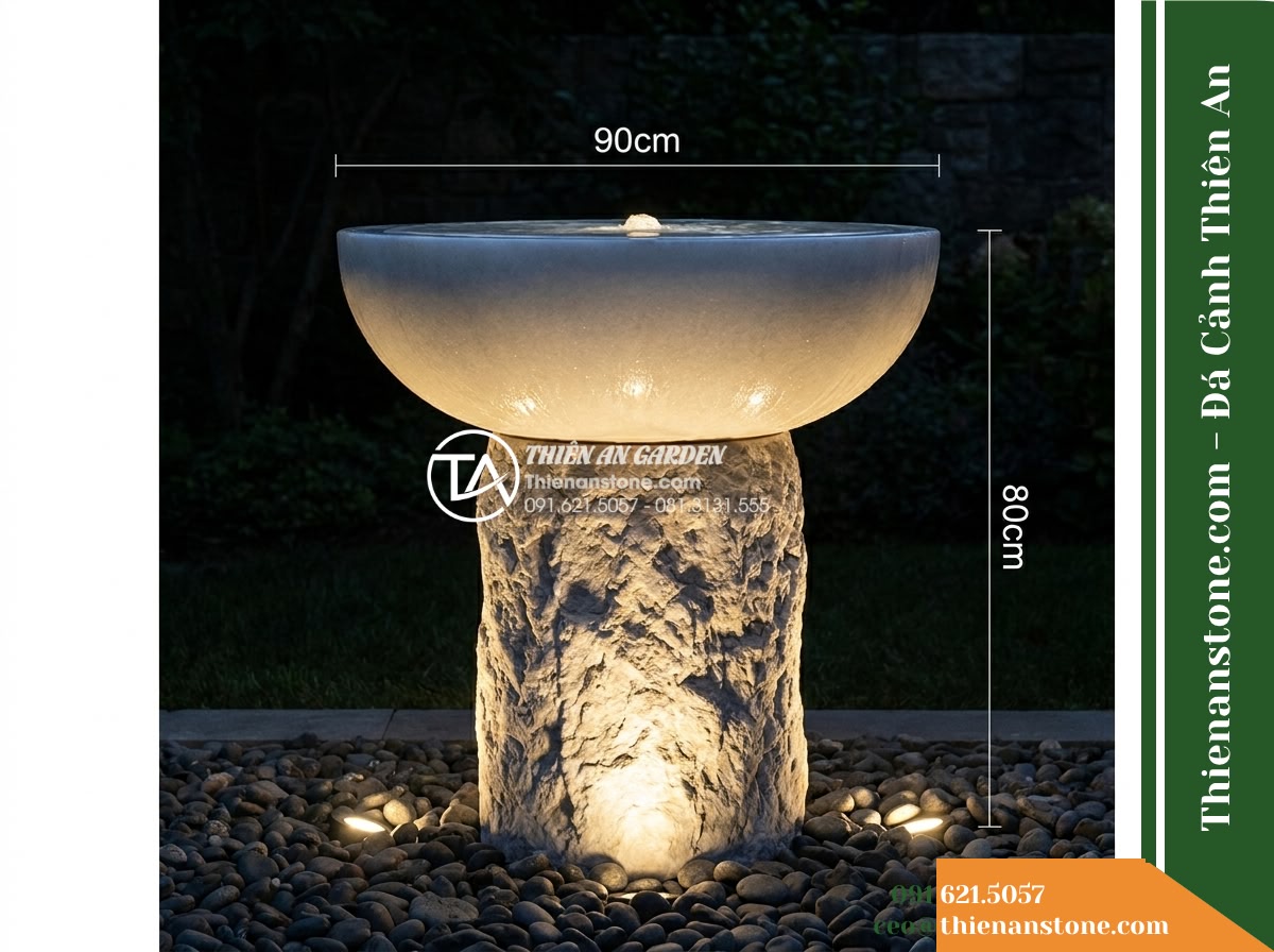 Đài Phun Bát Tròn Chân Trụ Thô, Bát D90cm Cao 80cm - Hình 14 Đài Phun Bát Tròn Chân Trụ Thô, Bát D90cm Cao 80cm - A night shot of the stone fountain subtly lit by concealed 3000K warm LED upligh