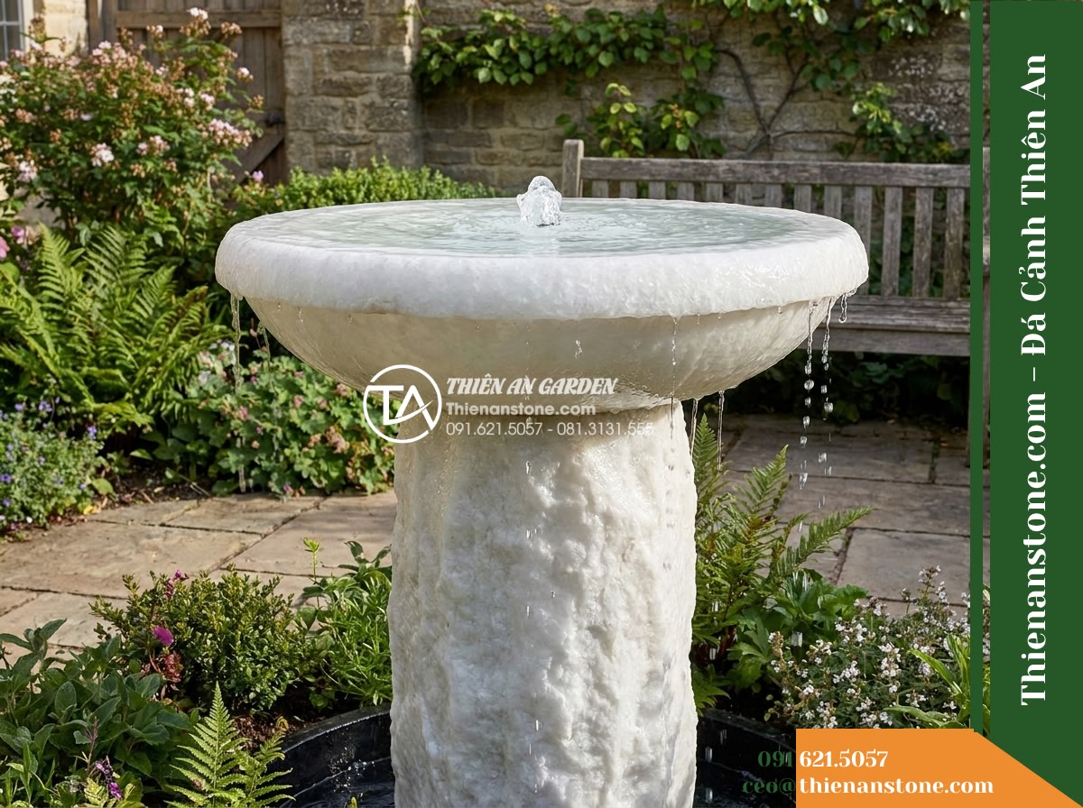 Đài Phun Bát Tròn Chân Trụ Thô, Bát D90cm Cao 80cm - Hình 19 Đài Phun Bát Tròn Chân Trụ Thô, Bát D90cm Cao 80cm - An authentic architectural photograph showing the completed natural stone founta