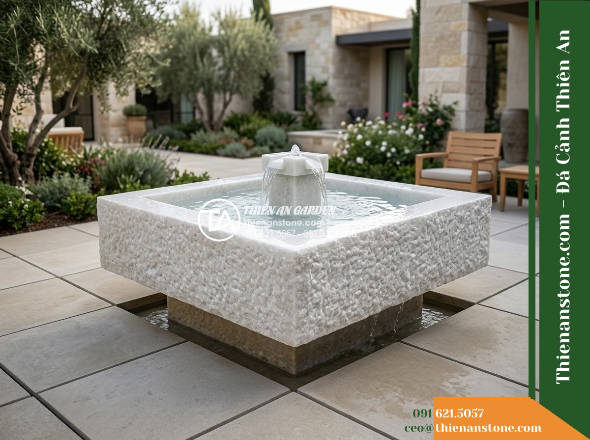 Đài Phun Bát Vuông Lòng Mài Mịn Vỏ Thô, Bát D80cm Cao 75cm - Hình 19 Đài Phun Bát Vuông Lòng Mài Mịn Vỏ Thô, Bát D80cm Cao 75cm - Artistic hero shot of the square stone fountain running smoothly, perfectly alig
