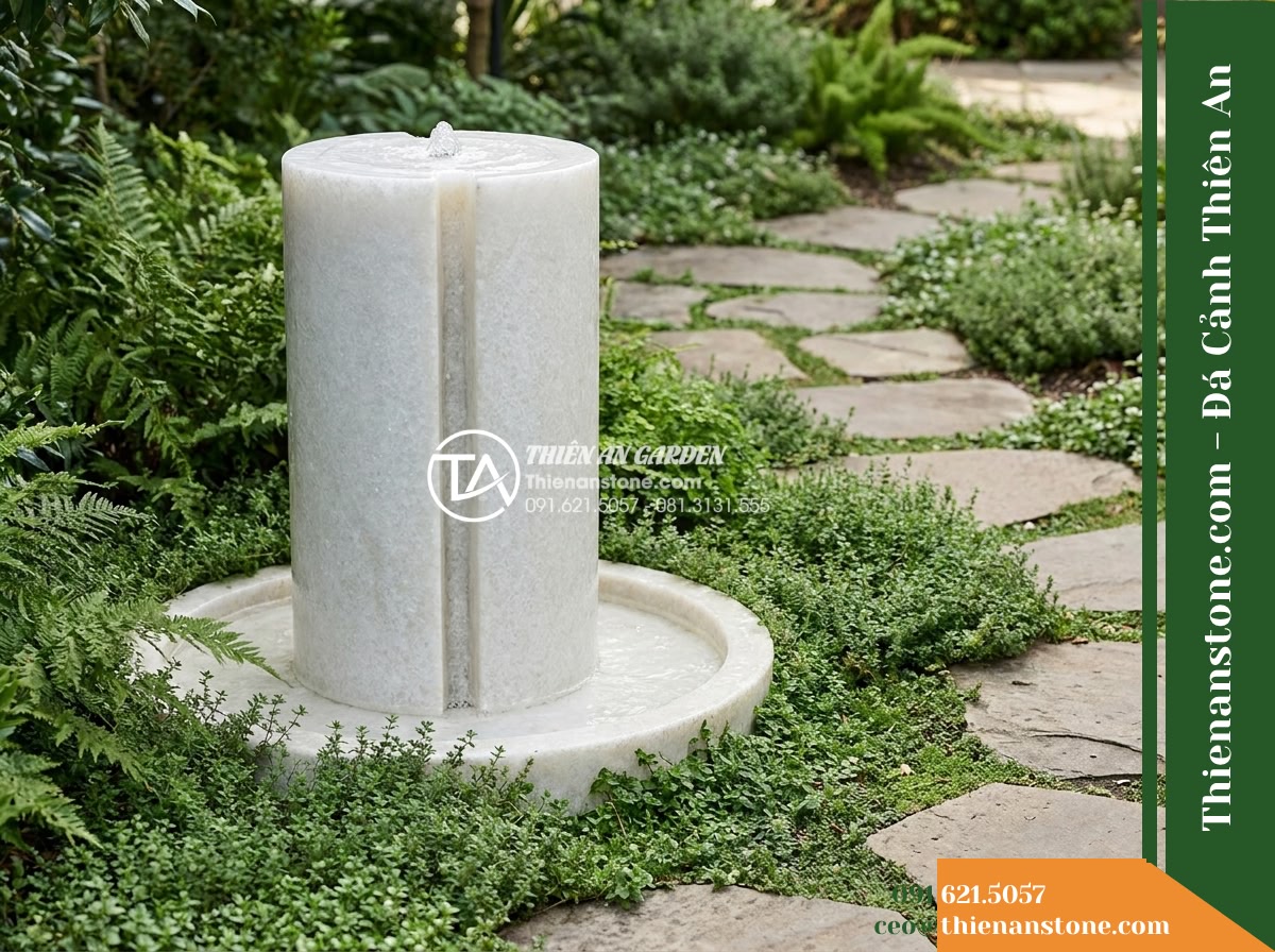 Đài Phun Khối Trụ Bổ Đôi Rãnh Trào, D50cm Cao 1m - Hình 10 Đài Phun Khối Trụ Bổ Đôi Rãnh Trào, D50cm Cao 1m - Alternative architectural perspective of the same cylindrical stone fountain vie