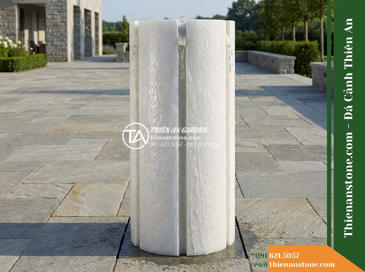 Đài Phun Khối Trụ Bổ Đôi Rãnh Trào, D50cm Cao 1m - Hình 12 Đài Phun Khối Trụ Bổ Đôi Rãnh Trào, D50cm Cao 1m - Wide outdoor shot showcasing the generous viewing corridor required for the D50c