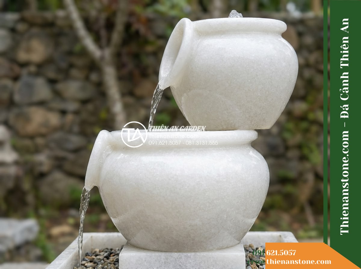 Đài Phun Lu Nước Xếp 2 Tầng Lệch, D40cm Cao 90cm - Hình 8 Đài Phun Lu Nước Xếp 2 Tầng Lệch, D40cm Cao 90cm - Side elevation profile view demonstrating the water circulation from the dual ja