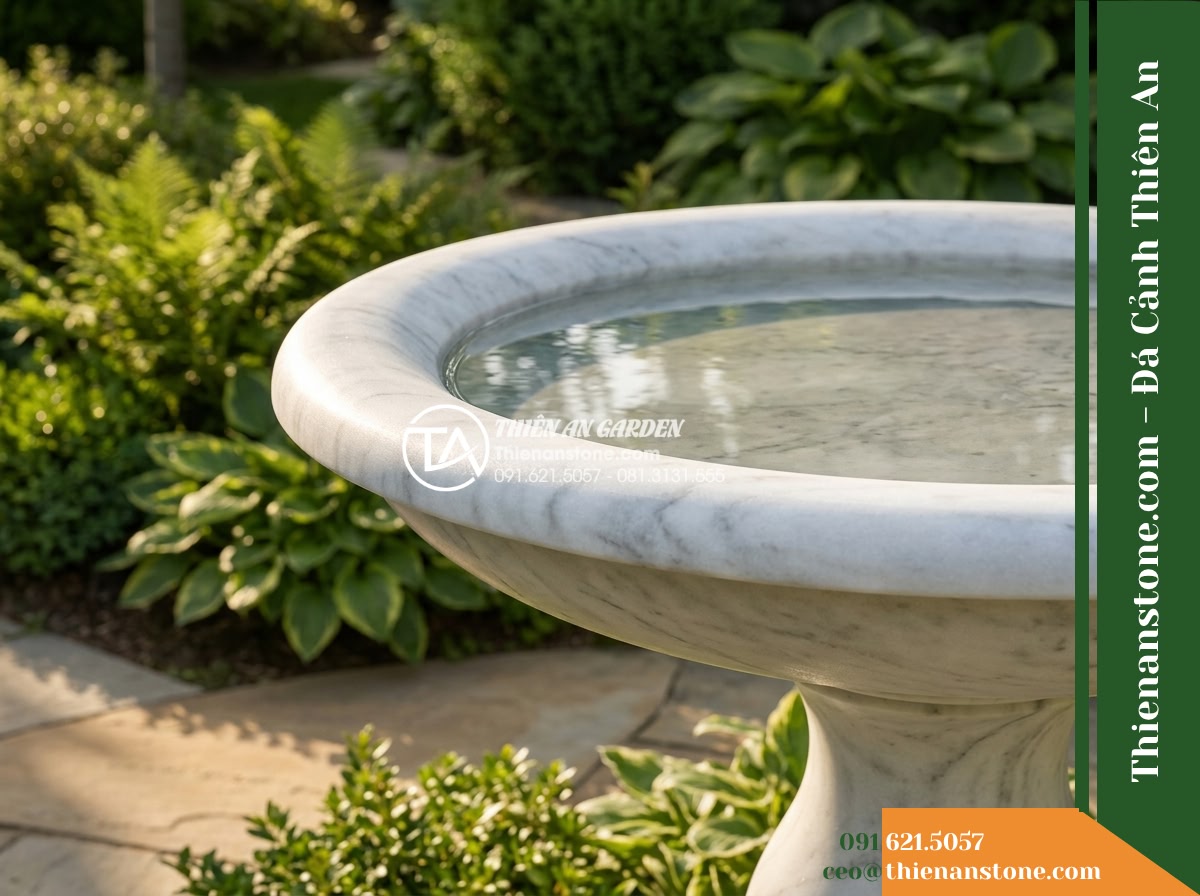 Đài Phun Trắng Mịn Vành Bo Tròn Lụa, Bát D80cm Cao 1.2m - Hình 13 Đài Phun Trắng Mịn Vành Bo Tròn Lụa, Bát D80cm Cao 1.2m - Raking side natural light skimming across the rounded lip of the white stone bow