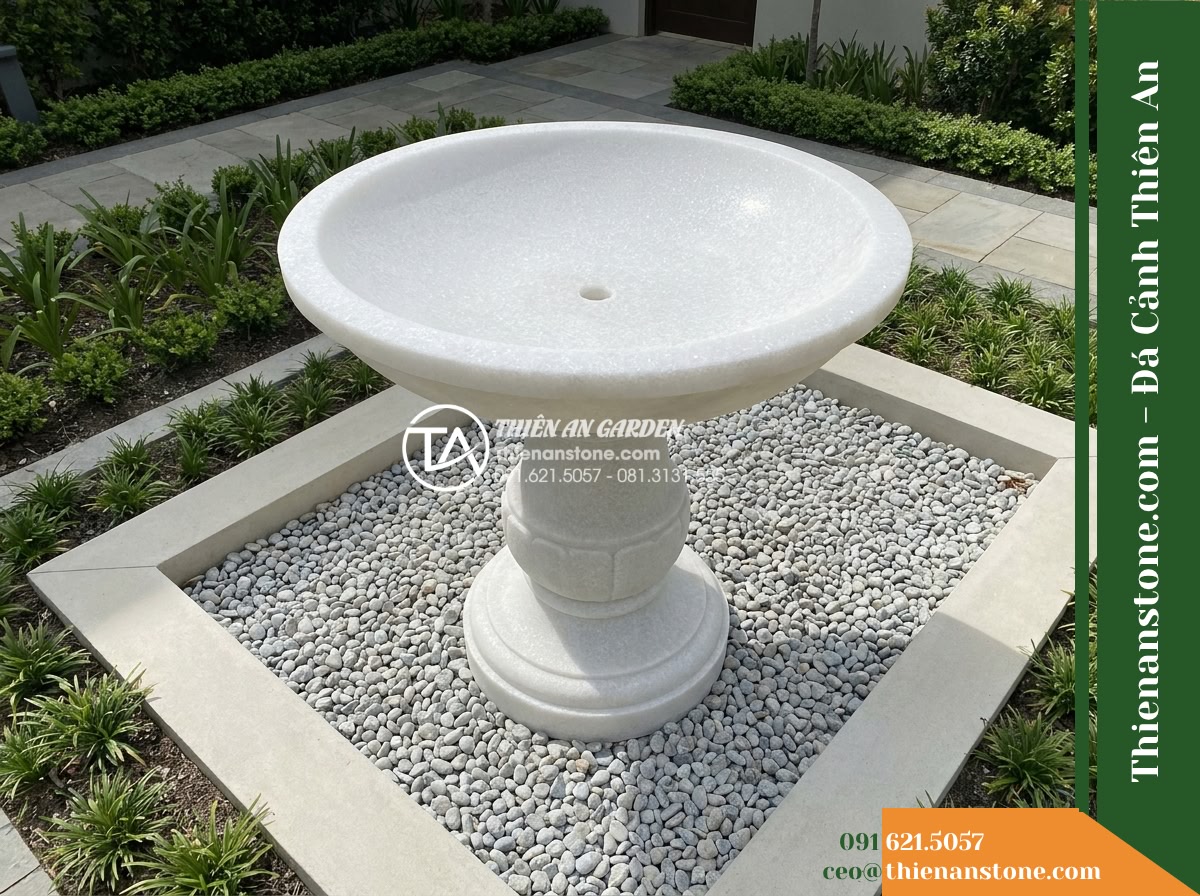 Đài Phun Trắng Sáng Cắt Doa Tinh Tế, Bát D1.2m Cao 1.7m - Hình 6 Đài Phun Trắng Sáng Cắt Doa Tinh Tế, Bát D1.2m Cao 1.7m - Elevated perspective showing the full footprint of the white stone fountain surr