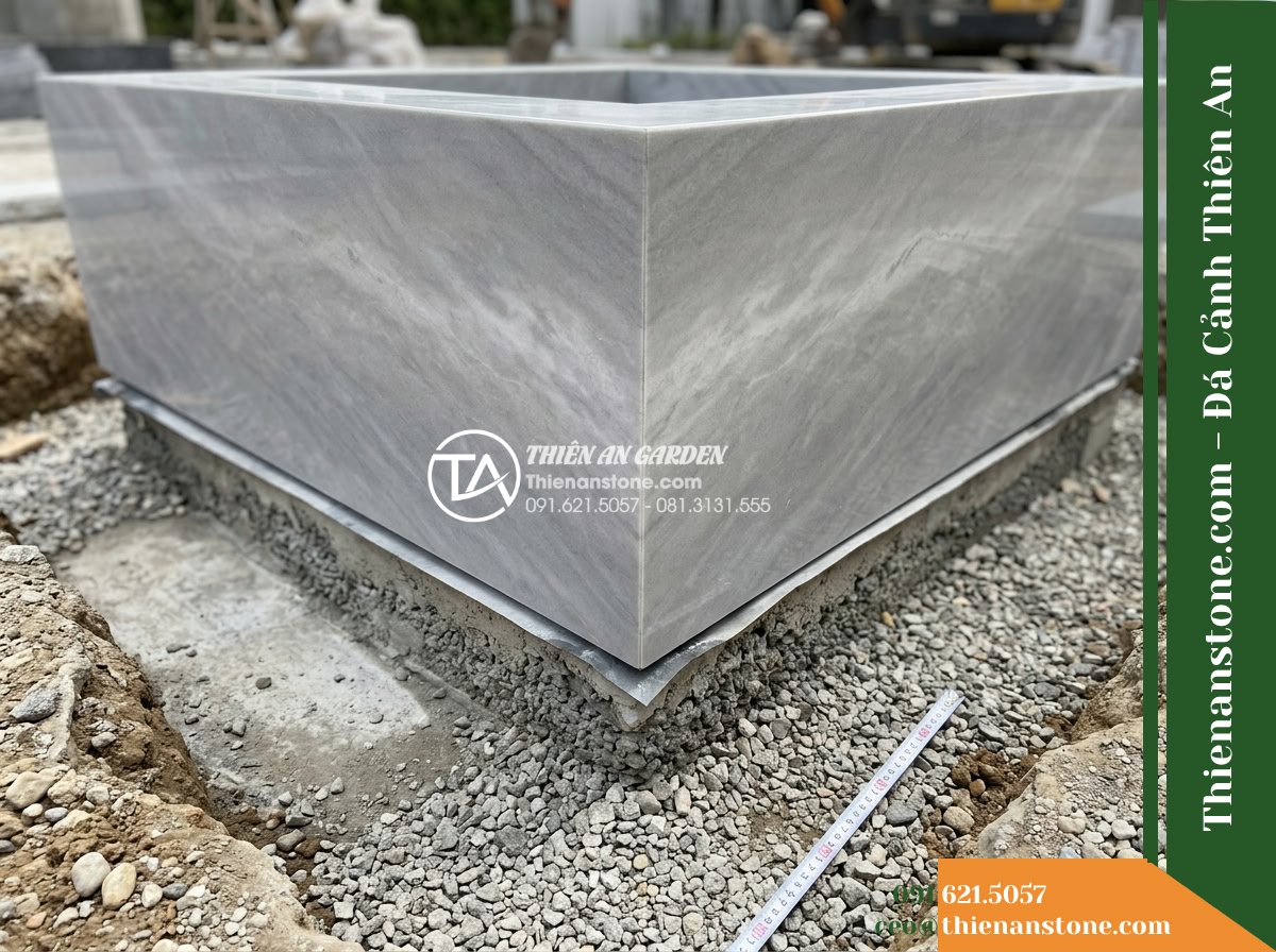 Đài Phun Xám Vân Mây Cắt Khối Cặp, 70x70cm Cao 1.1m - Hình 17 Đài Phun Xám Vân Mây Cắt Khối Cặp, 70x70cm Cao 1.1m - Technical architectural focus on the junction where the 70x70cm base meets the f