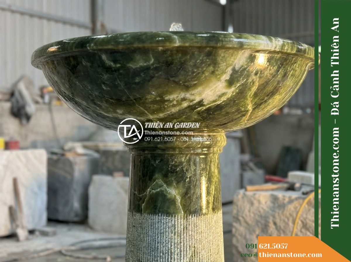 Đài Phun Xanh Thấu Quang Đỉnh Phun, Bát D85cm Cao 1.3m - Hình 4 Đài Phun Xanh Thấu Quang Đỉnh Phun, Bát D85cm Cao 1.3m - A low-angle detailed shot showing the graceful transition from the wide curved g