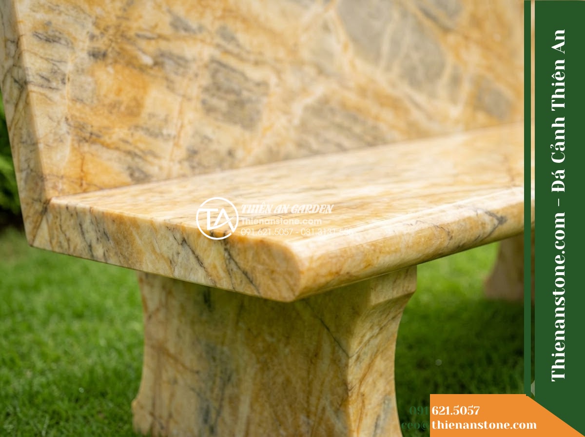 Ghế Đá Công Viên Không Tựa Bản Rộng Thịnh Vượng 180x55x45cm - Đá Vàng Cẩm Thạch - Hình 2 Ghế Đá Công Viên Không Tựa Bản Rộng Thịnh Vượng 180x55x45cm - Đá Vàng Cẩm Thạch - golden marble stone bench with natural veins, sitting on a manicured lawn with t