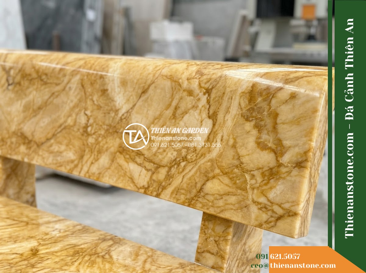 Ghế Đá Công Viên Không Tựa Bản Rộng Thịnh Vượng 180x55x45cm - Đá Vàng Cẩm Thạch - Hình 3 Ghế Đá Công Viên Không Tựa Bản Rộng Thịnh Vượng 180x55x45cm - Đá Vàng Cẩm Thạch - golden marble stone bench flanked by potted bonsai trees on a resort terrace ove
