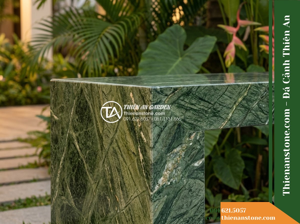 Ghế Đá Công Viên Không Tựa Chân Khối Trường Xuân 160x45x45cm - Đá Xanh Cẩm Thạch - Hình 4 Ghế Đá Công Viên Không Tựa Chân Khối Trường Xuân 160x45x45cm - Đá Xanh Cẩm Thạch - A green marble stone bench integrated into a Vietnamese luxury resort landscape