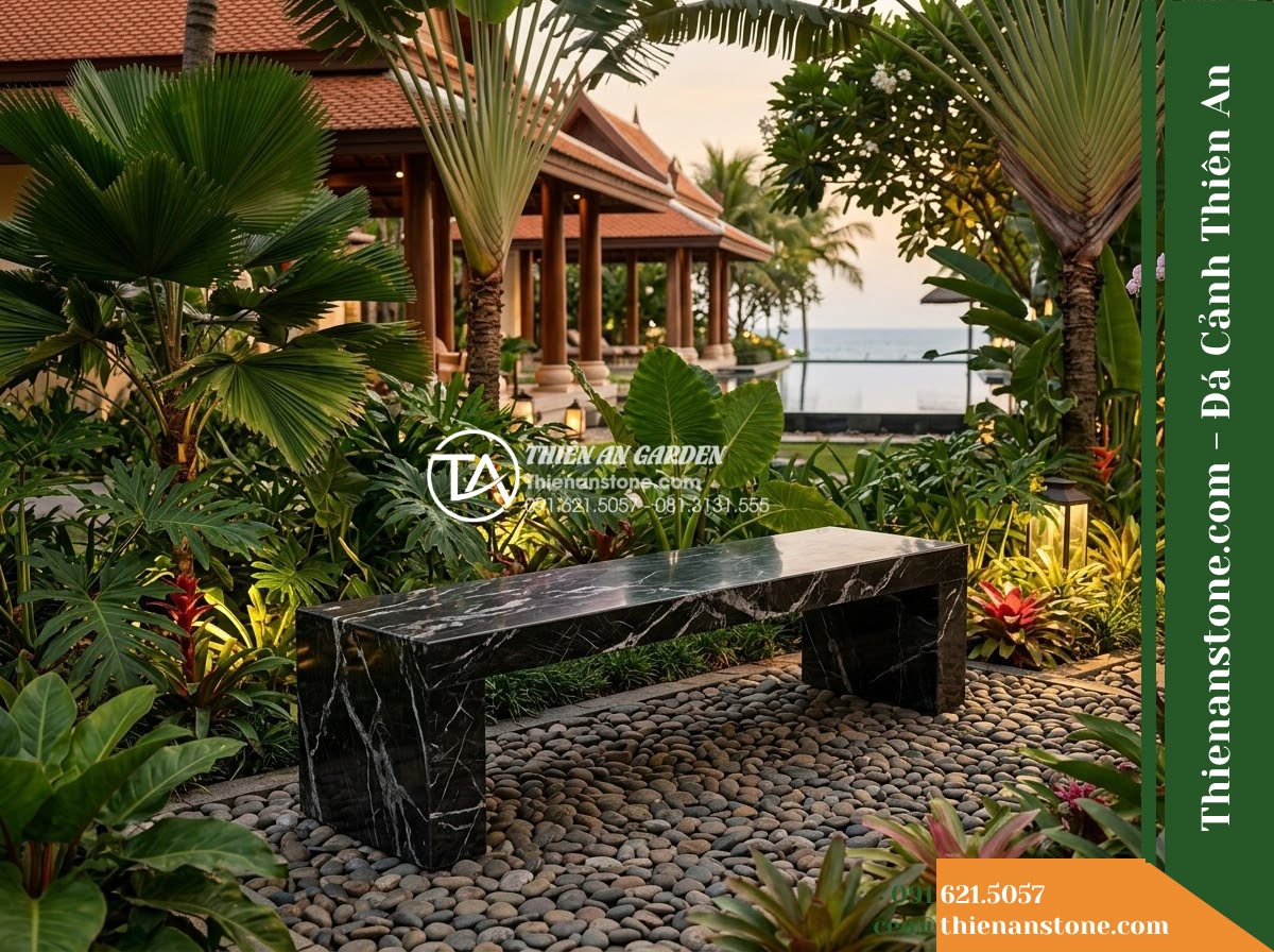 Ghế Đá Công Viên Không Tựa Mặt Phẳng Trường Sơn 160x45x45cm - Đá Đen Cẩm Thạch - Hình 4 Ghế Đá Công Viên Không Tựa Mặt Phẳng Trường Sơn 160x45x45cm - Đá Đen Cẩm Thạch - A black marble stone bench integrated into a Vietnamese luxury resort landscape