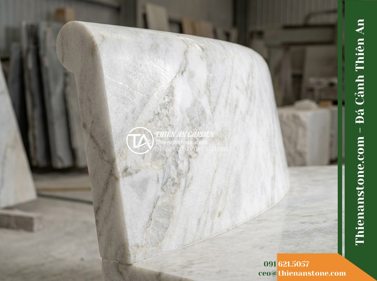Ghế Đá Granite Nguyên Khối Tâm An – Kích thước 150 x 46 x 45 cm – Kiểu dáng mặt phẳng bo góc nhỏ, chân hộp. Chất liệu đá granite - Hình 4 Ghế Đá Granite Nguyên Khối Tâm An – Kích thước 150 x 46 x 45 cm – Kiểu dáng mặt phẳng bo góc nhỏ, chân hộp. Chất liệu đá granite - A natural granite stone bench integrated into a Vietnamese luxury resort landsca