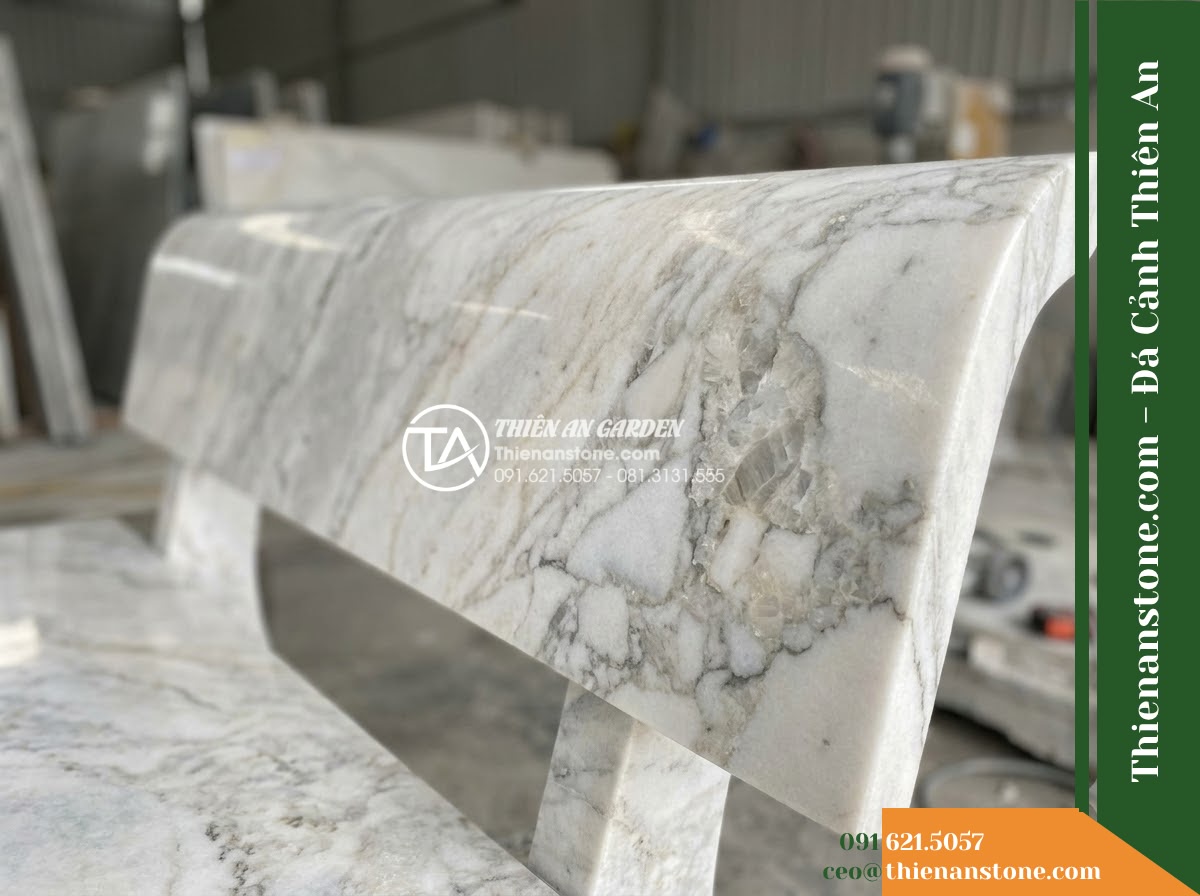 Ghế Đá Granito An Nhiên – Kích thước 150 x 48 x 78 cm – Kiểu dáng tựa cong ôm lưng, mặt ngồi bo cạnh. Chất liệu đá granito (đá mài) - Hình 2 Ghế Đá Granito An Nhiên – Kích thước 150 x 48 x 78 cm – Kiểu dáng tựa cong ôm lưng, mặt ngồi bo cạnh. Chất liệu đá granito (đá mài) - granito polished stone stone bench with natural veins, sitting on a manicured la