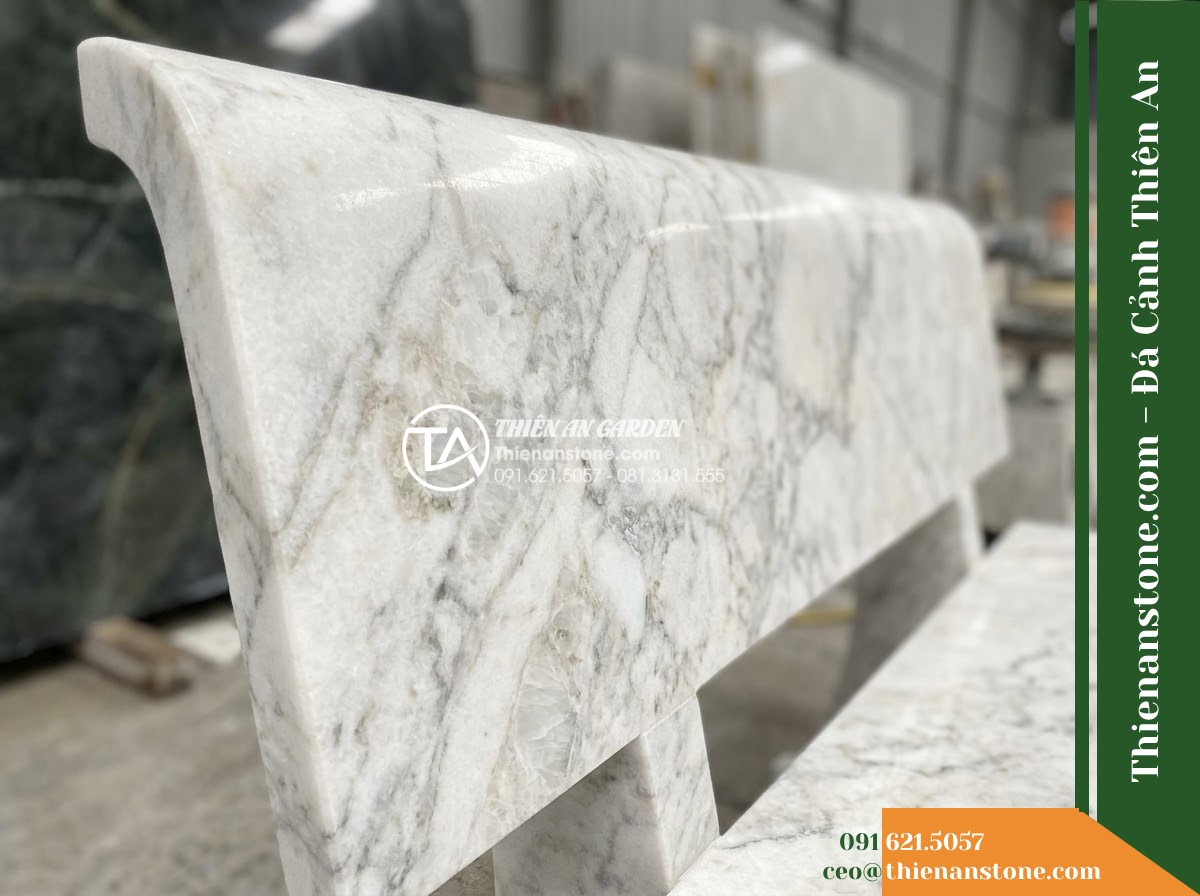 Ghế Đá Granito Gia Hưng – Kích thước 180 x 50 x 78 cm – Kiểu dáng tựa nan ngang, đường nét thanh thoát. Chất liệu đá granito (đá mài) - Hình 3 Ghế Đá Granito Gia Hưng – Kích thước 180 x 50 x 78 cm – Kiểu dáng tựa nan ngang, đường nét thanh thoát. Chất liệu đá granito (đá mài) - granito polished stone stone bench flanked by potted bonsai trees on a resort te
