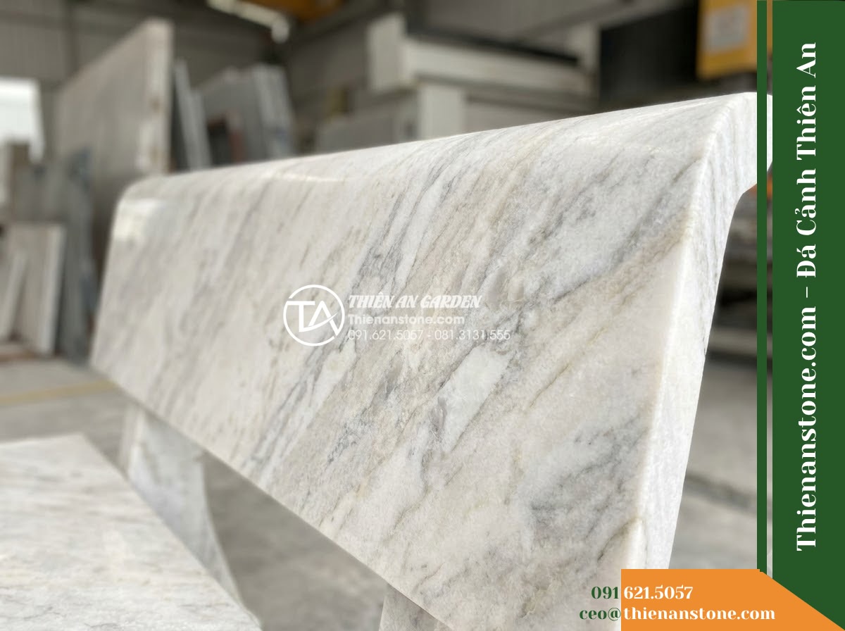 Ghế Đá Granito Minh Châu – Kích thước 180 x 50 x 80 cm – Kiểu dáng tựa nan dọc cổ điển, tay vịn bo tròn. Chất liệu đá granito (đá mài) - Hình 2 Ghế Đá Granito Minh Châu – Kích thước 180 x 50 x 80 cm – Kiểu dáng tựa nan dọc cổ điển, tay vịn bo tròn. Chất liệu đá granito (đá mài) - Aerial view of a granito polished stone stone bench positioned beside a koi pond