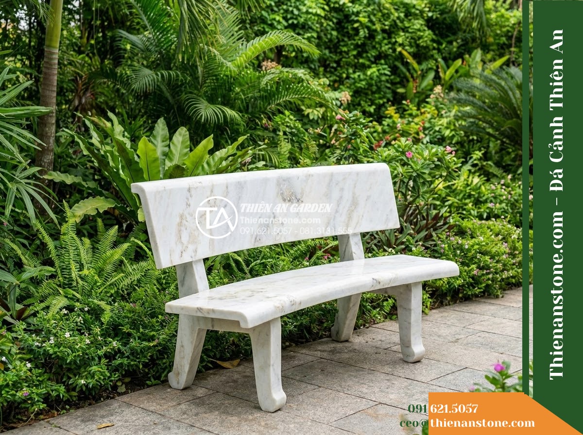 Ghế Đá Granito Minh Phát – Kích thước 180 x 50 x 80 cm – Kiểu dáng tựa nan ngang lớn, tay vịn cong. Chất liệu đá granito (đá mài) - Hình 2 Ghế Đá Granito Minh Phát – Kích thước 180 x 50 x 80 cm – Kiểu dáng tựa nan ngang lớn, tay vịn cong. Chất liệu đá granito (đá mài) - A granito polished stone stone bench placed in a lush Vietnamese garden, wide an