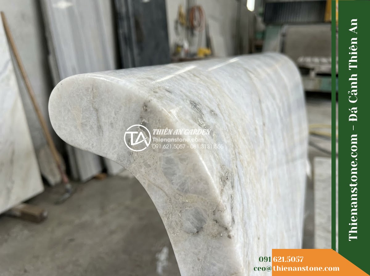 Ghế Đá Granito Phúc Thịnh – Kích thước 170 x 50 x 78 cm – Kiểu dáng tựa nan dọc thưa, hai đầu vuốt cong. Chất liệu đá granito (đá mài) - Hình 3 Ghế Đá Granito Phúc Thịnh – Kích thước 170 x 50 x 78 cm – Kiểu dáng tựa nan dọc thưa, hai đầu vuốt cong. Chất liệu đá granito (đá mài) - Stone bench of granito polished stone beside a cascading water feature at night,
